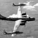 A Boeing ETB-29A Superforterss transports two Republic EF-84D Thunderjets as part of Project Tip-Tow (US Air Force)